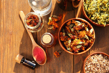 Canvas Print - Different tinctures and ingredients on wooden table, flat lay