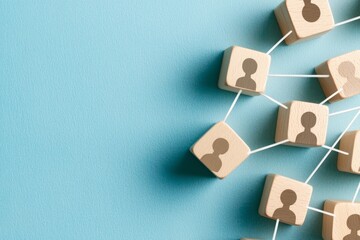 Poster - Various wooden blocks connect to each other on a blue background. Concept of teamwork