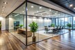 © Achiraya - Modern minimalist office interior featuring a sleek glass partition dividing the open space, with sleek flooring, and subtle natural light shining through the walls.