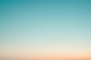  A serene gradient sky blending soft blue and warm peach hues, perfect for creating a calm and peaceful atmosphere.