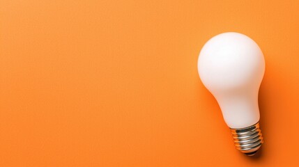 Fototapete - 3D rendering of light bulb concept on orange background.