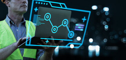 Leinwandbilder - Engineer hand arm monitoring manufacturing factory plant, manager managing controlling using computer holographic display analysis innovation technology, male engineer, banner background.