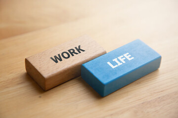 Work life balance concept; wooden block with word work and life