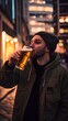 © Felippe Lopes - Man in a beanie drinks a beer on a city street.