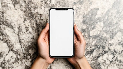 Wall Mural - Person holding a smartphone with a blank white screen, against a marble textured background.