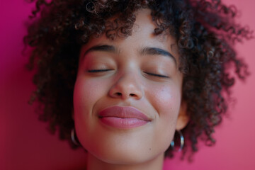 Sticker - A woman with curly hair is smiling and looking at the camera