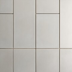 Wall Mural - close-up view of a tiled surface. The tiles are rectangular and have a light grey color with a slightly textured, matte finish