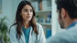 © AdobeInspire - Female doctor having a serious conversation with a patient in a medical office.