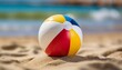 © Artbi - Isolated beach ball with depth of field on a sandy summer background