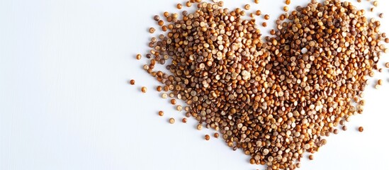 Wall Mural - Quinoa seeds positioned in a heart shape and set against a white background. Copy space image. Place for adding text and design