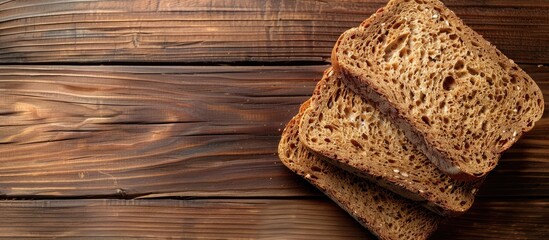 Poster - Close up of whole wheat bread on a wooden table background top view copy space