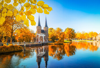 Wall Mural - view of oosrpoort iconic historical gate in delft, holland netherlands at fall day