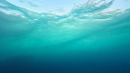 Poster - Rays of sunlight are filtering through the surface of a deep blue ocean, creating a mesmerizing underwater scene. The tranquil and mysterious atmosphere invites exploration and wonder