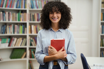 Cute dark-haired young woman looking happy and excited