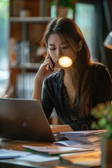 Sticker - A person taking a call while seated at a desk, great for business or personal use