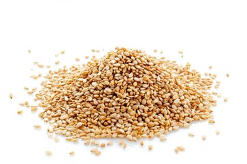 Poster - A close-up view of a pile of sesame seeds on a white surface, ideal for food and cooking illustrations