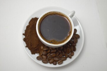 coffee, coffee beans, close-up on a white background, cup of coffee