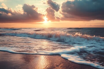 Beautiful ocean sunset with waves crashing on the sandy beach