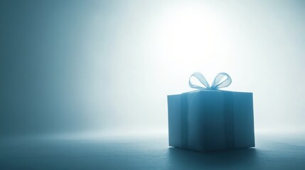 Wall Mural - A Single Blue Gift Box with a Bow in a Blue and White Gradient Background