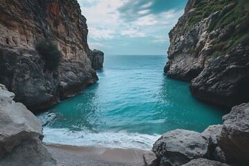 Wall Mural - Secluded Cove with Clear Blue Water and Rocky Cliffs