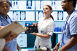 © DC Studio - Diverse doctors team looking at radiography scan test result to check organs condition, examining liver and lungs to fight illness. Group of physicians discussing healthcare services for wellness.
