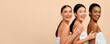 © Prostock-studio - Body Care. Three Beautiful Multiracial Women Posing In Bath Towels Over White Studio Background. Panorama, Free Space For Text