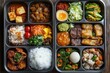 © At My Hat - Delicious Asian cuisine in a bento box. Perfect for illustrating a meal, travel, or Asian culture.