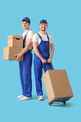 Sticker - Loaders carrying cardboard boxes on blue background