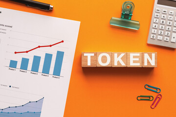 Poster - There is wood cube with the word Token. It is as an eye-catching image.