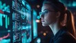 © Juan - Focused businesswoman analyzing data on futuristic screen