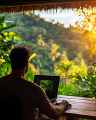 Poster - A man is sitting at a desk with a laptop in front of him. He is looking at the screen, possibly working or browsing the internet. Concept of focus and concentration, as the man is engaged in his task