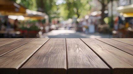 Poster - A wooden table in the foreground with a blurred market scene in the background.