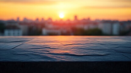 Canvas Print - A blurred sunset view over a city skyline with a textured surface in the foreground.