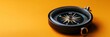 © Supriyanto - A close-up of a compass on an orange background, symbolizing navigation and direction.