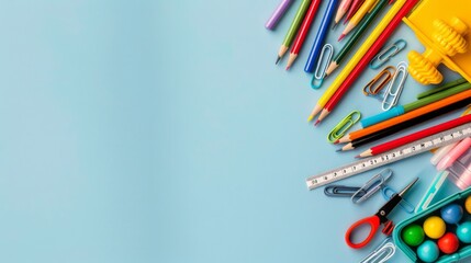 well-organized desk filled with school supplies such as pens, rulers, and sharpened pencils, offering a clean and bright background with copy space for text