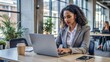 © nilawan - Businesswoman Working on Laptop in Modern Office.