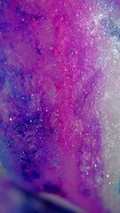 Wall Mural - Vertical video. Glitter paint spill. Ink drip. Defocused blue pink purple white color shimmering bokeh light particles texture fluid mix flow motion abstract art background.