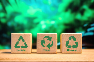 Wooden blocks with reduce, reuse, recycle symbol. Environmental concept.