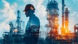 © jiraphat - A man in a hard hat stands in front of a large industrial plant. The sky is cloudy and the sun is setting, casting a warm glow over the scene. Concept of industry and hard work
