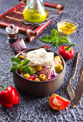 Wall Mural - Greek salad with tomatoes, feta cheese, cucumbers, onions and olives