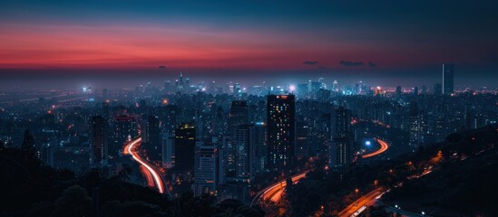 Wall Mural - Cityscape at Dusk with a Road Winding Through the City