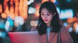 © Matcha_09 - An Asian woman working on a laptop.