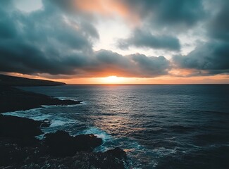 Wall Mural - Dramatic Sunset Over the Ocean with Cloudy Sky