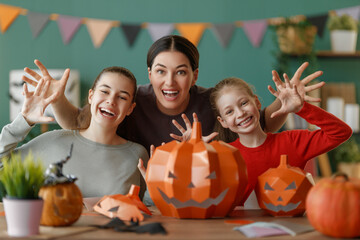 Wall Mural - Happy family preparing for Halloween.