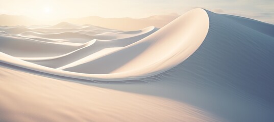 Softly rolling sand dunes at sunrise in a vast desert landscape