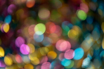 Abstract colorful bokeh defocused party lights background. Bokeh lights background.