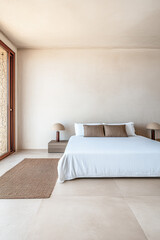 Wall Mural - Modern minimalist bedroom design with neutral tones and natural light in a tranquil setting