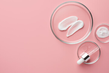 Poster - Petri dishes with cosmetic products and pipette on pink background, flat lay. Space for text