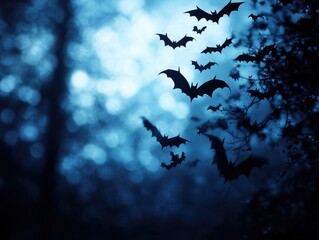 A flock of bats silhouetted against a moody dark nighttime sky filled with ominous clouds creating a haunting