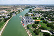 © AmazingAerialAgency - Aerial view of the beautiful Pecos River and vibrant water park amidst the cityscape of Carlsbad, New Mexico.